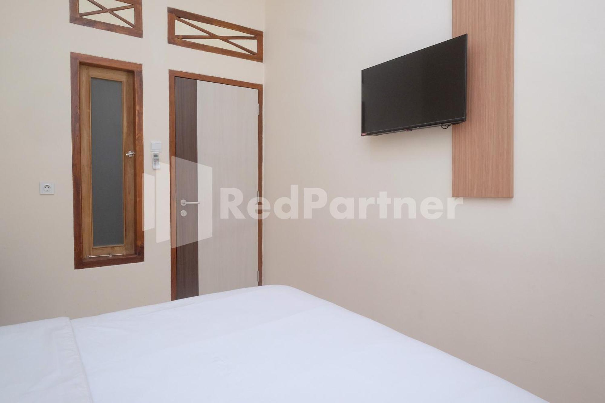 Отель Ndliman House Near Ugm Jogja Mitra Reddoorz Kejayan Экстерьер фото